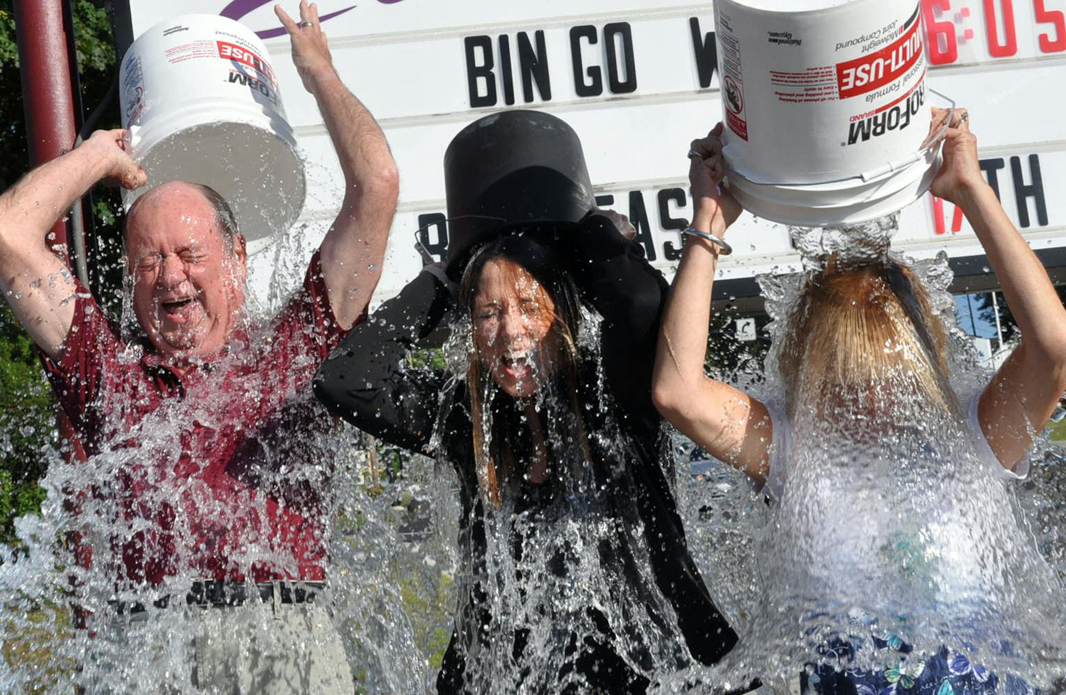 Mike Dolon, from left, Shannon Panisak and Linda Farley, all members of the Hazleton Elks Lodge 200, joined other local Elks and dumped a bucket of ice water over their heads as they challenge approximately 2,700 Elks Lodges throughout the United States to join them in raising money for ALS, also known as Lou Gehrig‚Äôs Disease. The ice bucket challenge was held Monday, August 18, 2014, at the lodge located on East Broad Street in Hazleton, Pa.(AP Photo/Hazleton Standard-Speaker
