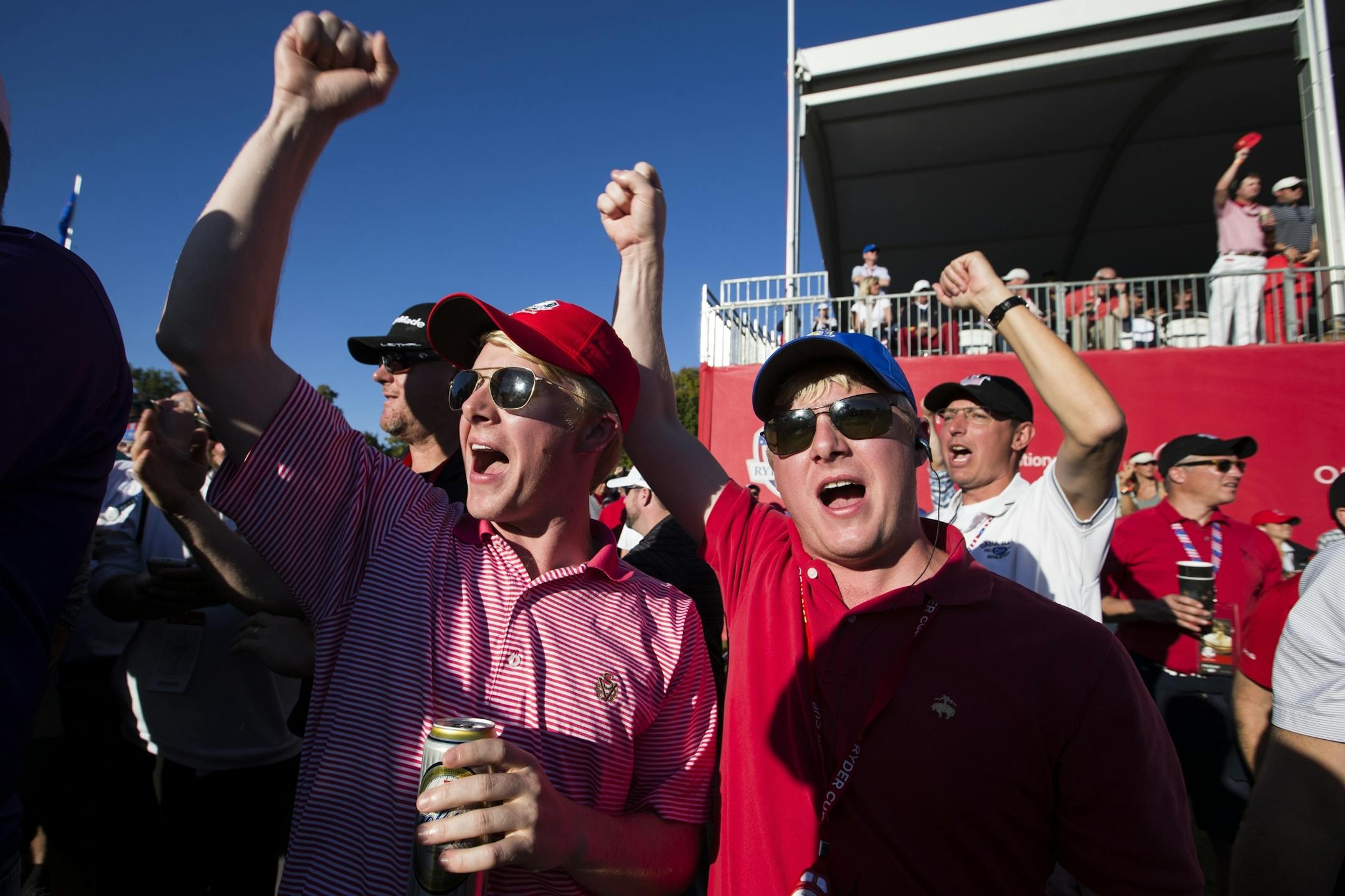 Twin brothers Thomas, left, and John Freeman of Augusta, Ga. cheer for the USA.