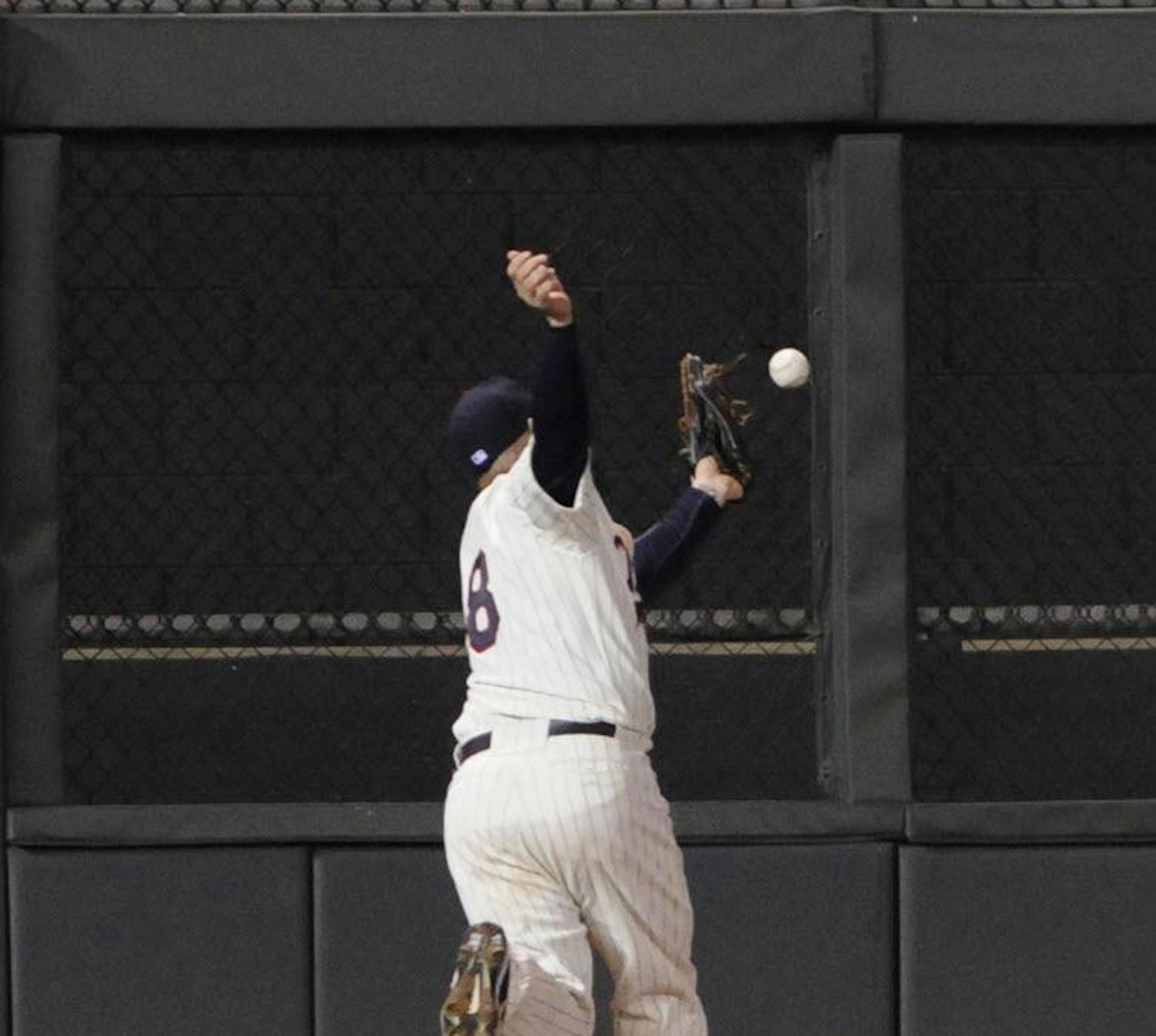 Ryan Doumit misses a fly ball in the eighth inning.