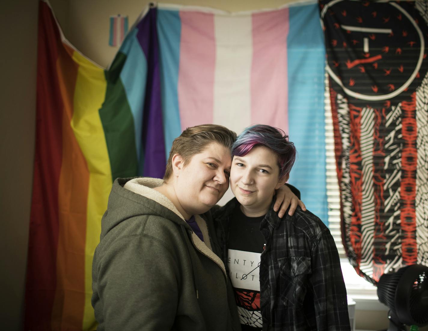 Alison Yocom, left, and her 13-year-old son, George, who is transgender, pose for a photo in their Minneapolis home ] LEILA NAVIDI &#x2022; leila.navidi@startribune.com BACKGROUND INFORMATION: Alison Yocom and her 13-year-old son, George, who is transgender, pose for a photo in their Minneapolis home on Thursday, February 23, 2017. Gov. Mark Dayton said Thursday that Minnesota schools should continue allowing transgender students to use the bathroom of their choice, calling it a human rights iss