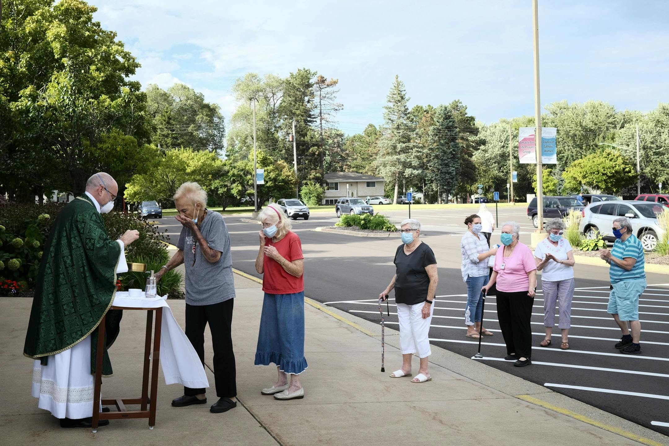 Transfiguration Catholic Church Fr. Brian Lynch gave to communion to mass goers Wednesday night.