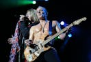 Def Leppard's Joe Elliott , left, and Phil Collen performed "Disintegrate" with the rest of the band. ]