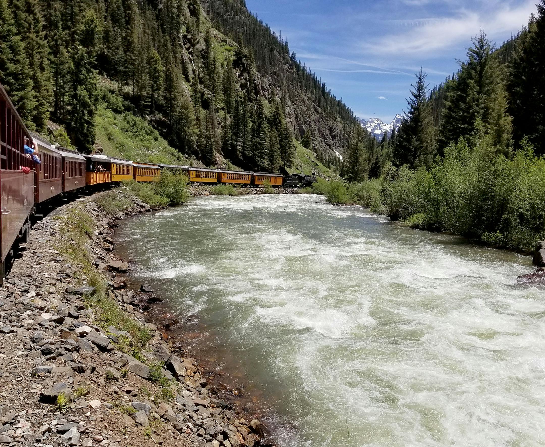 PHOTO: My husband, son and I were on the Narrow Gauge Railroad train, that has been in operation since 1883. It travels 45 miles north into the mountains from Durango, CO to the tiny mountain town of Silverton, CO. The trip takes 3.5 hours each way and winds along mountainsides and through breathtaking landscape. A large portion of the trip takes passengers through country that can only by reached by train and helicopter. This photo was taken midway between Durango and Silverton along the Animas
