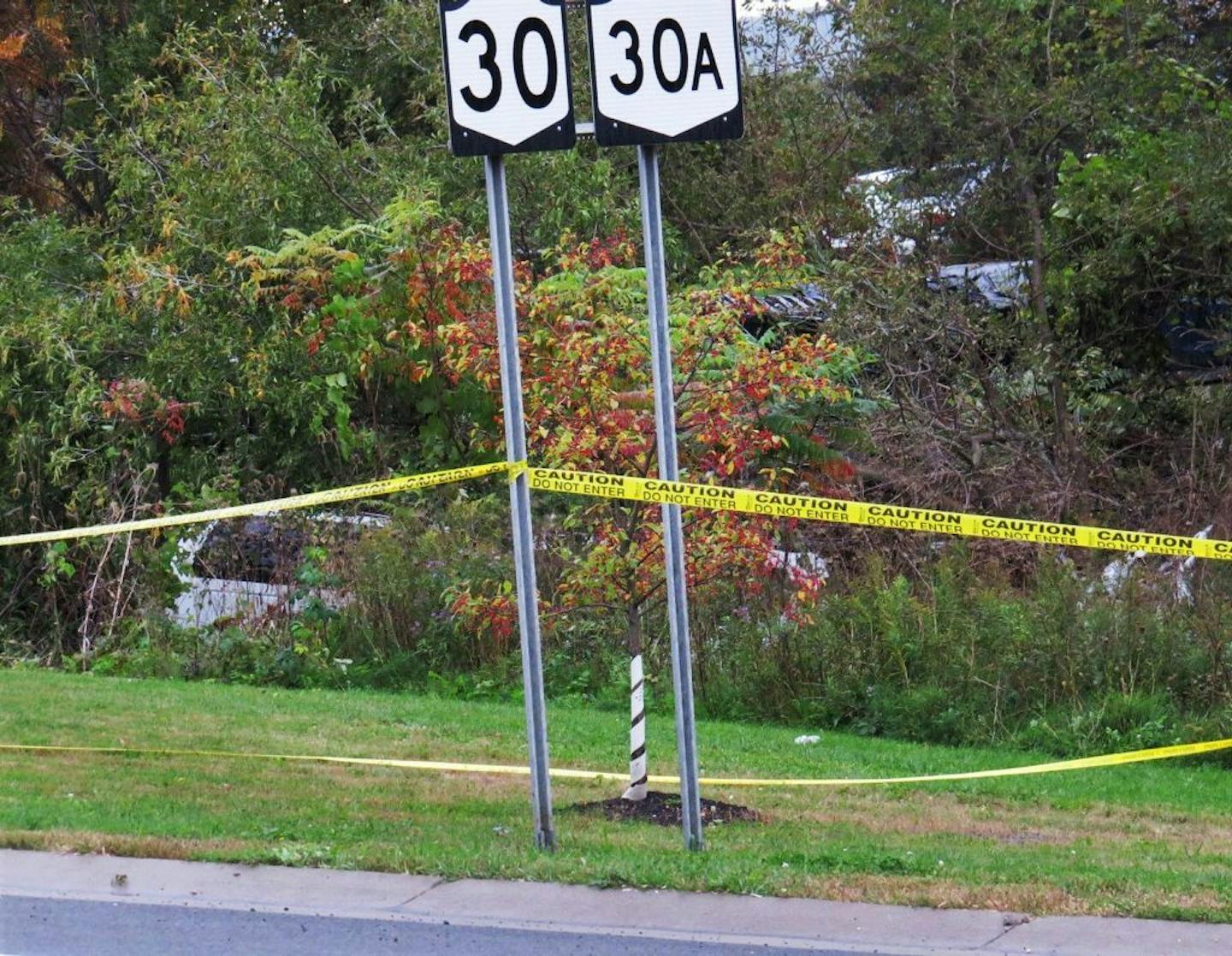 FILE - In this Oct. 6, 2018, file photo, a limousine, left, has landed in the woods following a fatal crash in Schoharie, N.Y. The National Transportation Safety Board said on Thursday, Jan. 10, 2019, that some federal employees furloughed under the government shutdown may be recalled to start examining the limousine that crashed in rural upstate New York, killing 20 people,