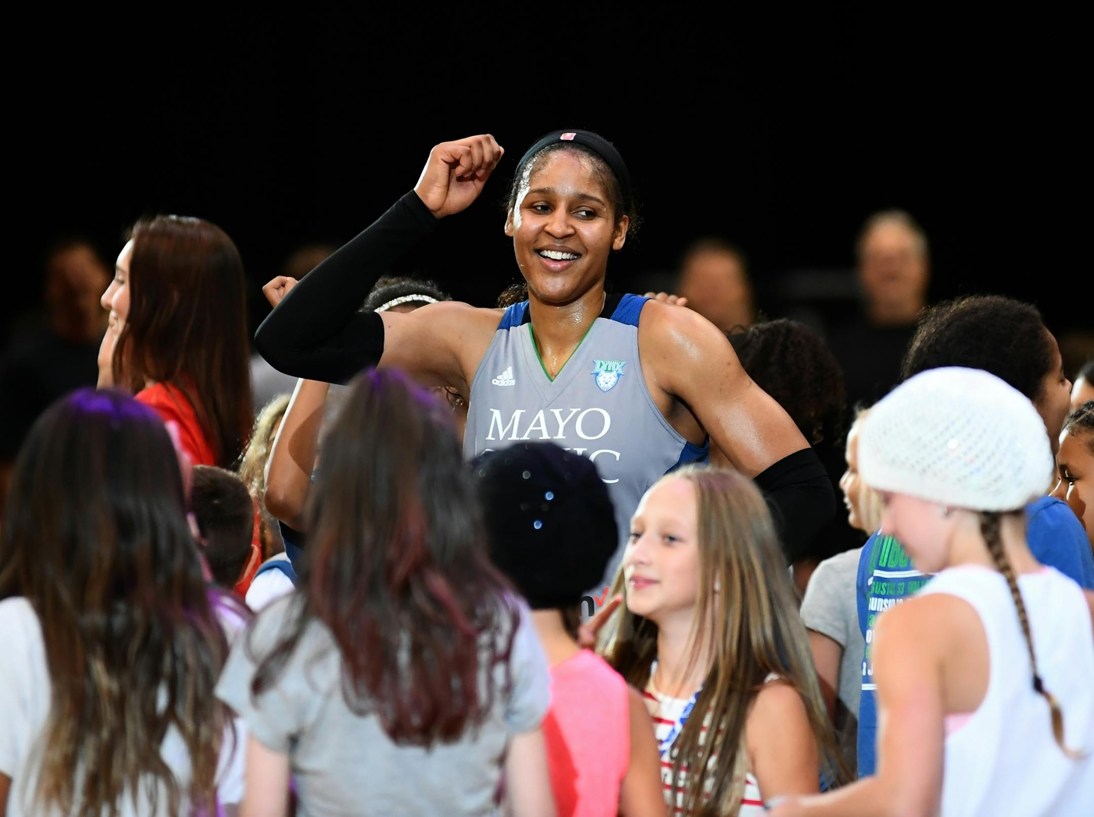 Minnesota Lynx forward Maya Moore (23) danced with young fans after Friday night's game against the Seattle Storm.