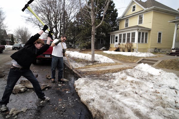 In the Hamline neighborhood in St. Paul, Levi,left, and his father Ron Peterson had it with winter and wanted the ice gone from the curb in front of t