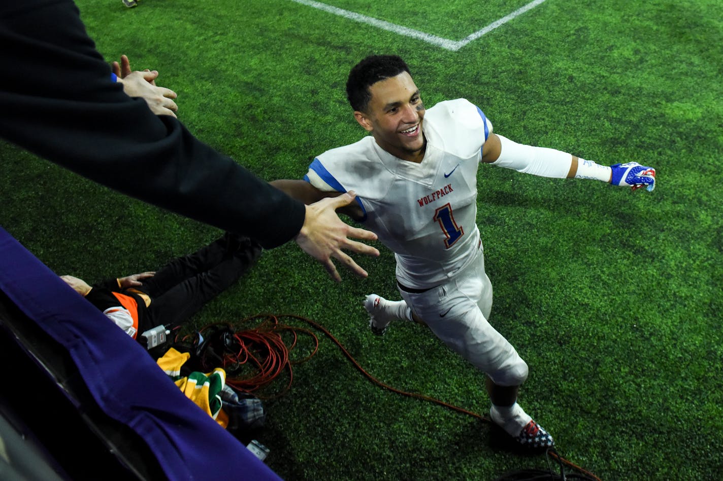 SMB Wolfpack quarterback Jalen Suggs (1) high-fived members of the student section after his team's 4A championship victory against Willmar. ] Aaron Lavinsky ¥ aaron.lavinsky@startribune.com