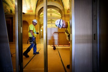 Here on the first floor, workers have closed off most of the wings of the State Capitol from the Rotunda with drywall and temporary steel supports as 