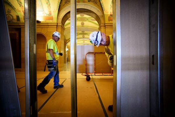 Here on the first floor, workers have closed off most of the wings of the State Capitol from the Rotunda with drywall and temporary steel supports as 