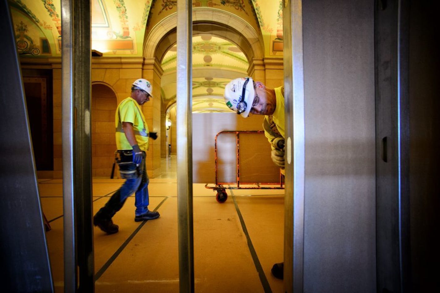 Here on the first floor, workers have closed off most of the wings of the State Capitol from the Rotunda with drywall and temporary steel supports as renovation on the top three floors gears up. Tuesday, July 7, 2014