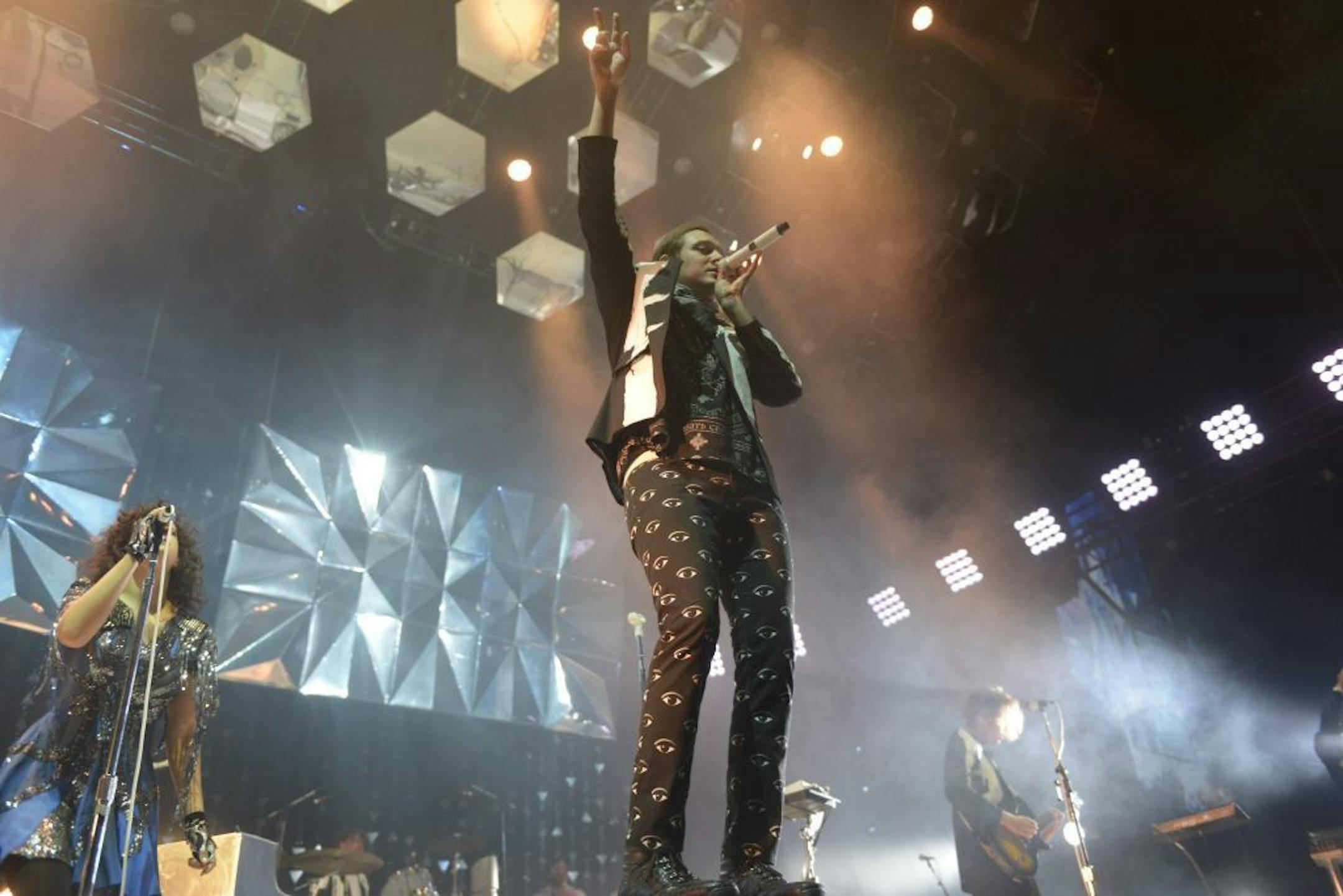 Arcade Fire's Win Butler, center, performed in front of a 12-piece band and an equally mega-minded visual backdrop Saturday at Target Center.
