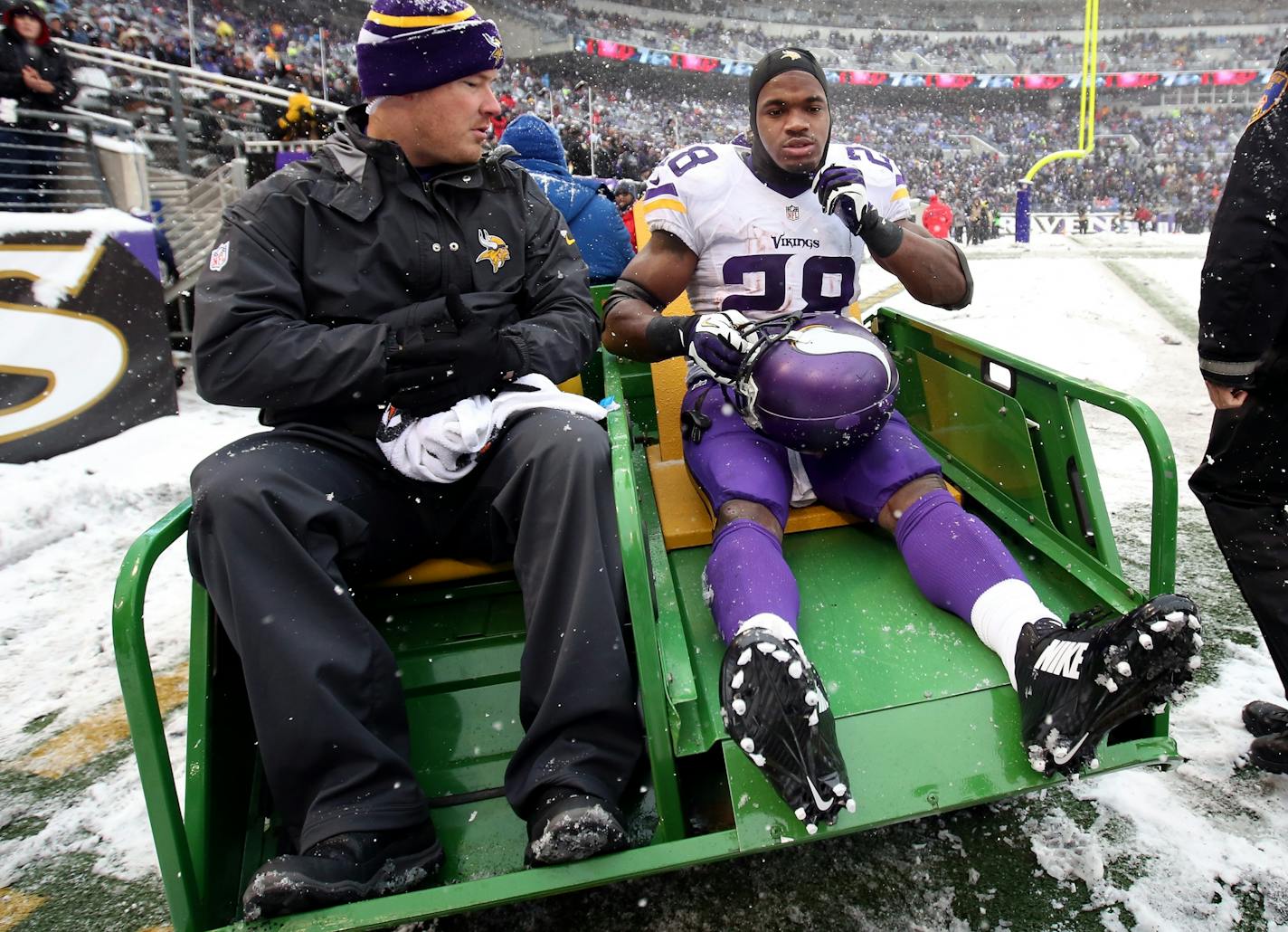 Minnesota Vikings running back Adrian Peterson (28) was carted off the field in the second quarter.