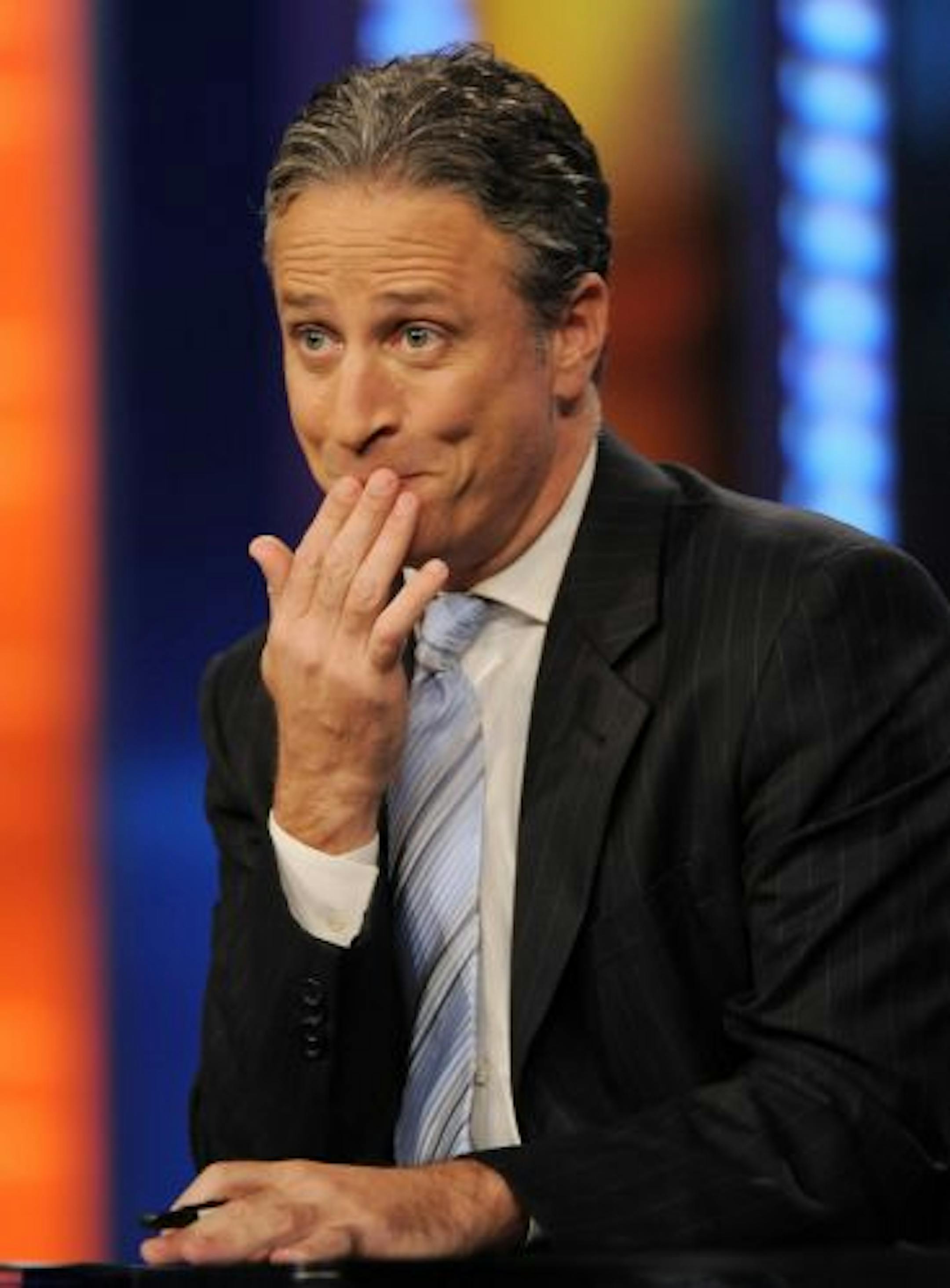 In this Oct. 8, 2008 file photo, host Jon Stewart gestures during a taping of "The Daily Show with Jon Stewart" in New York.
