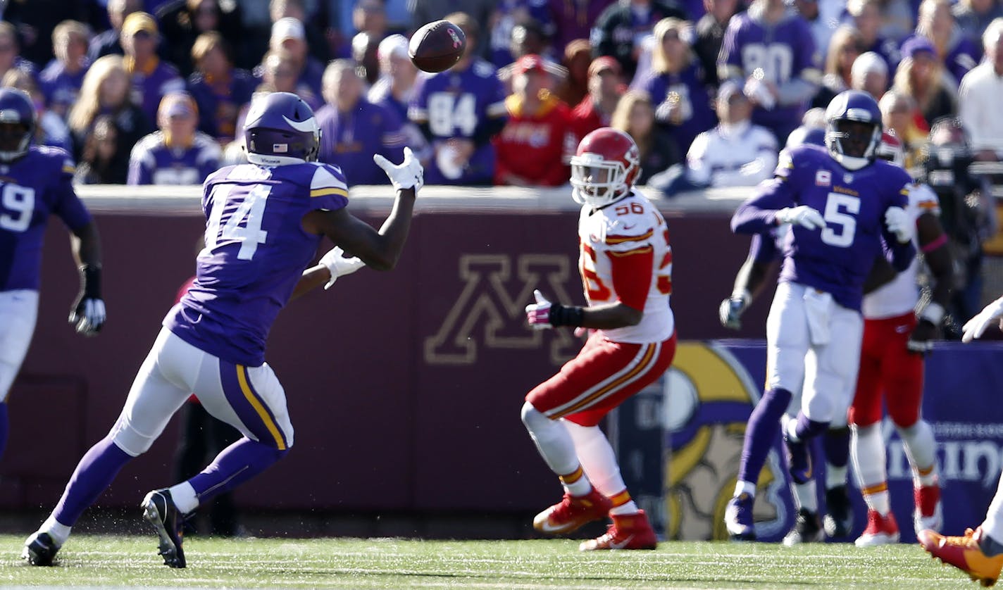 Stefon Diggs, left, found space between the Chiefs defense to haul in a key 30-yard pass from Teddy Bridgewater (5) on third-and-15.