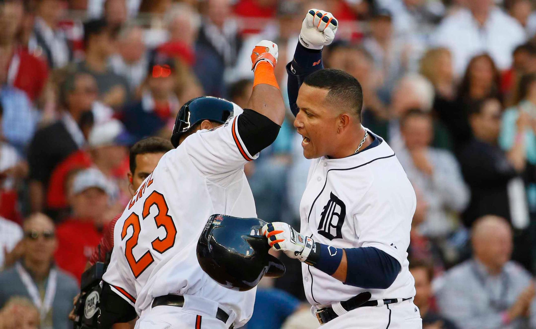 Miguel Cabrera of the Detroit Tigers celebrates with Nelson Cruz of Baltimore after Cabrera's first inning home run during the All Star Game at Target Field on July 15, 2014 in Minneapolis