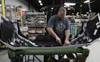 Machine operator Ed Lloyd works on the rear end of a General Motors Chevrolet Cruze at Jamestown Industries, Wednesday, Nov. 28, 2018, in Youngstown, 