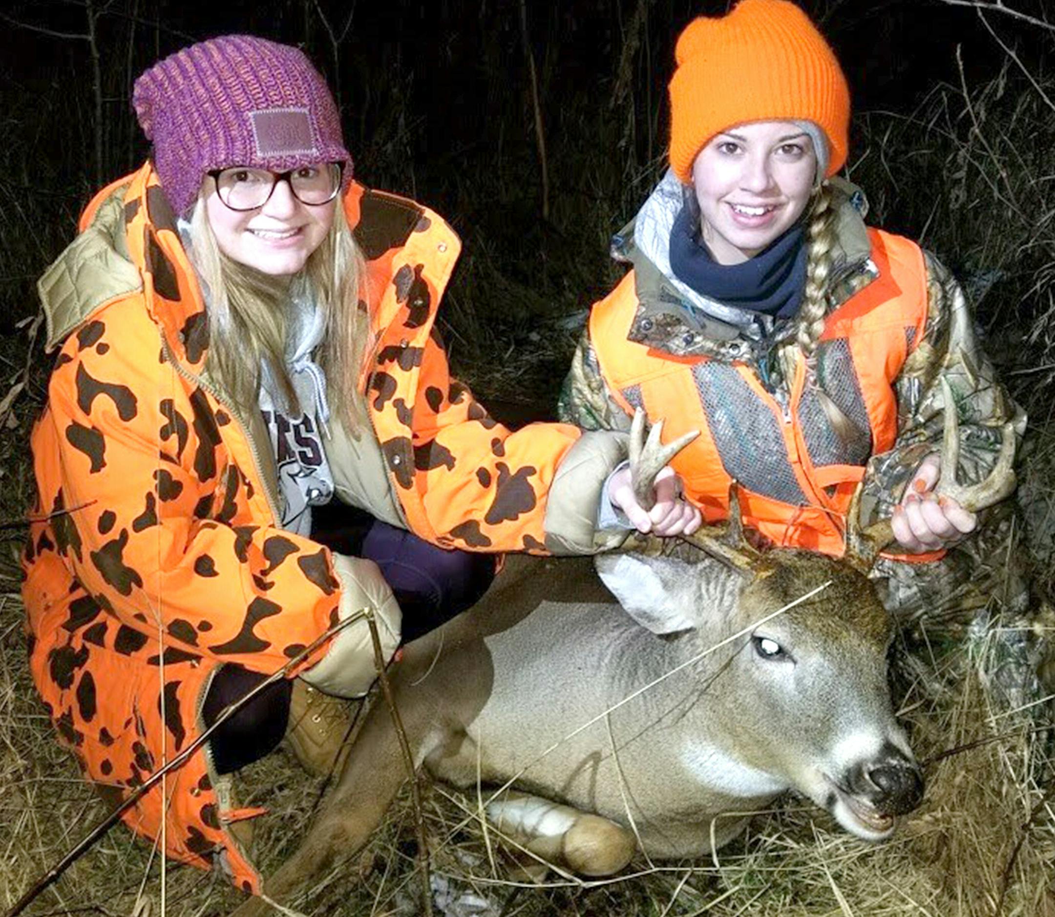 Hunting buddies Calli Cederberg, left, and her cousin Haley Cederberg with Haley's eight point buck. They were hunting with family near Sebeka, Minn., on the last day of firearms season last November.