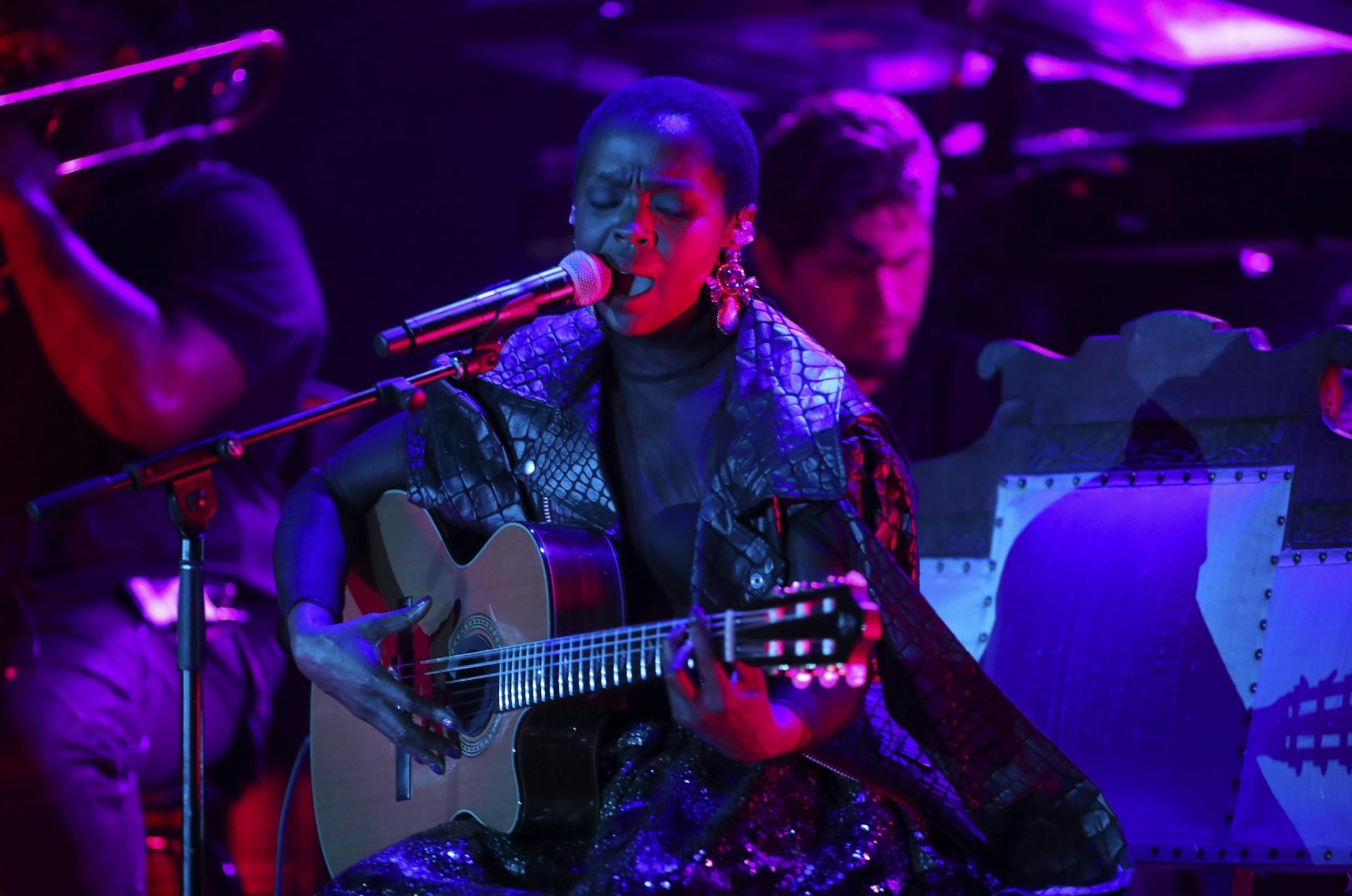 Lauryn Hill on the First Ave. stage with her band early in her set Sunday night.
