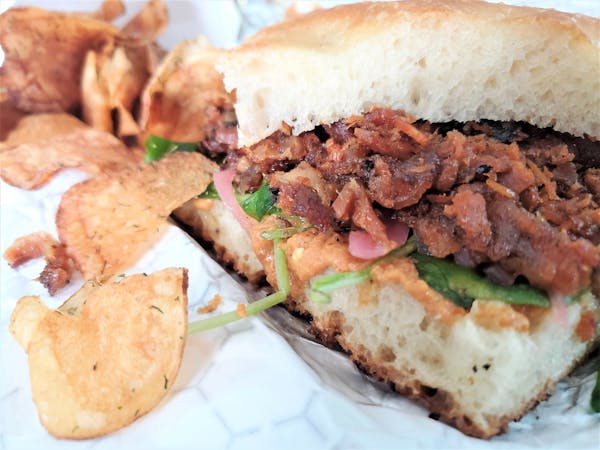 Porchetta sandwich and dill pickle chips from Lake City Sandwiches.