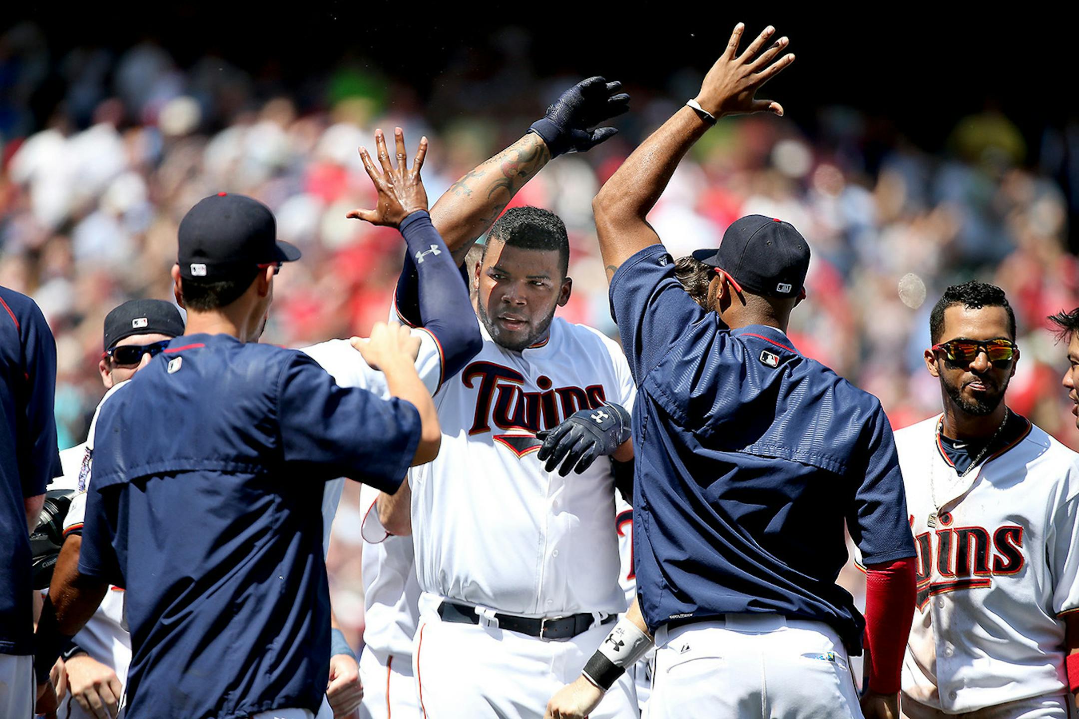 Kennys Vargas was greeted by teammates after he hit a solo homo run to win the game at the bottom of the ninth inning between the Minnesota Twins and St. Louis Cardinals, Thursday, June 18, 2015 at Target Field in Minneapolis, MN.