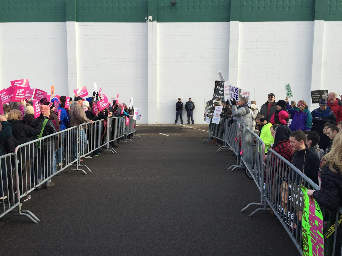 Protesters on both sides of Planned Parenthood — those who support it, left, and those who want to defund it — gather Saturday in St. Paul.