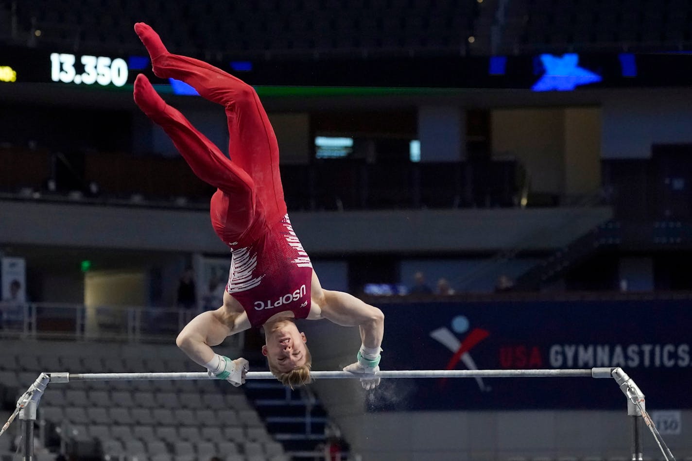 Shane Wiskus takes the first of three falls while competing in the high bar during the U.S. Gymnastics Championships, Saturday, June 5, 2021, in Fort Worth, Texas. (AP Photo/Tony Gutierrez)