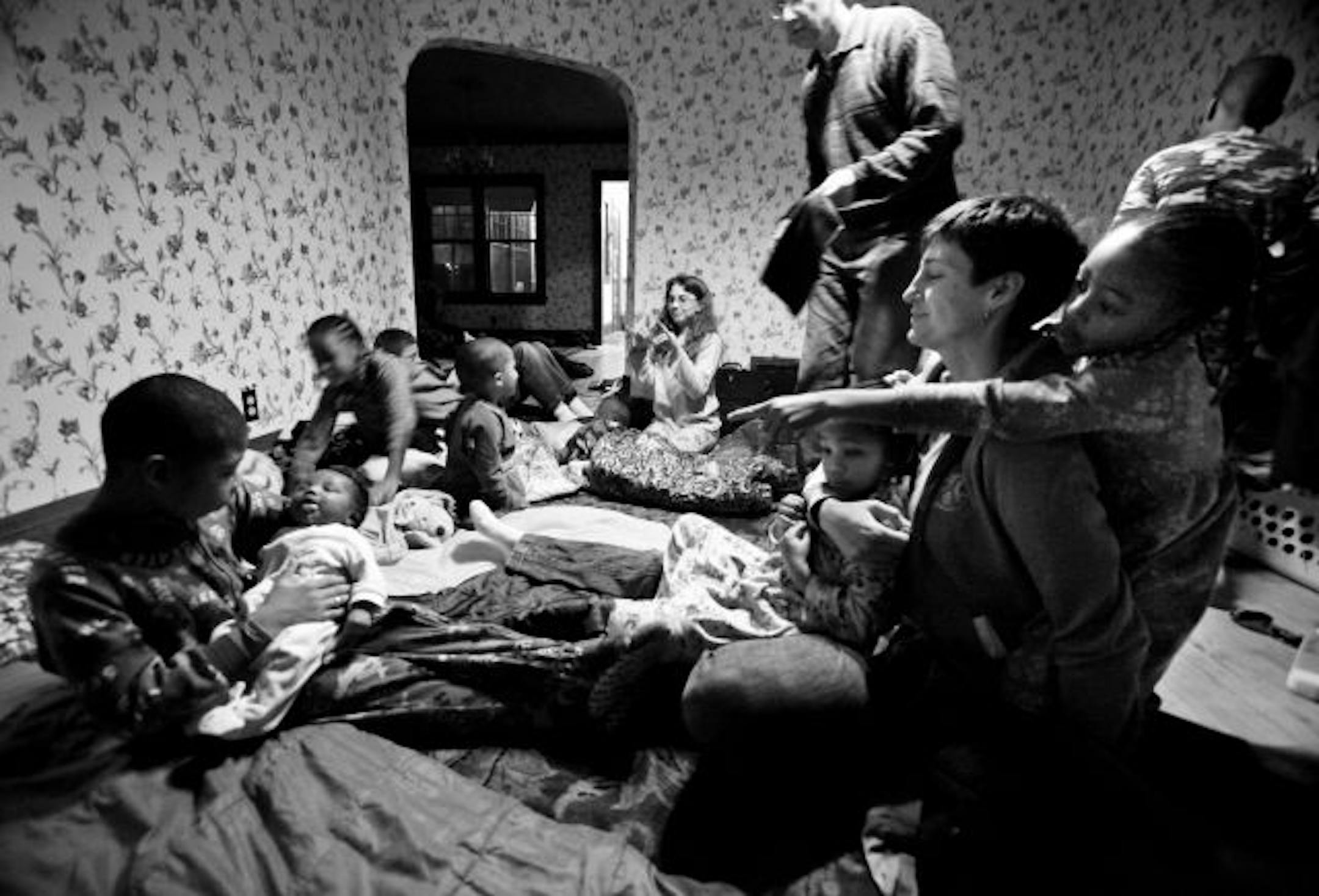 The Robert and Dorothy Bode family prepared to spend the night in sleeping bags on the livingroom and diningroom floors before setting out on the journey to their new home in Colorado.