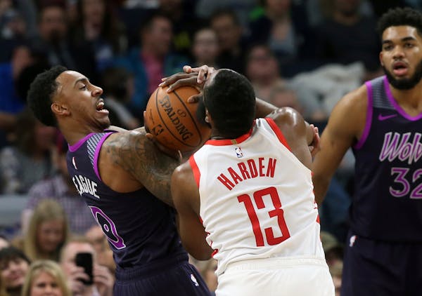 James Harden and Jeff Teague battle for the ball Wednesday night at Target Center.