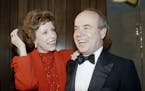 FILE - In this April 26, 1986 file photo, Carol Burnett, left, and veteran comrade in comedy Tim Conway laugh during a gala birthday party for Burnett