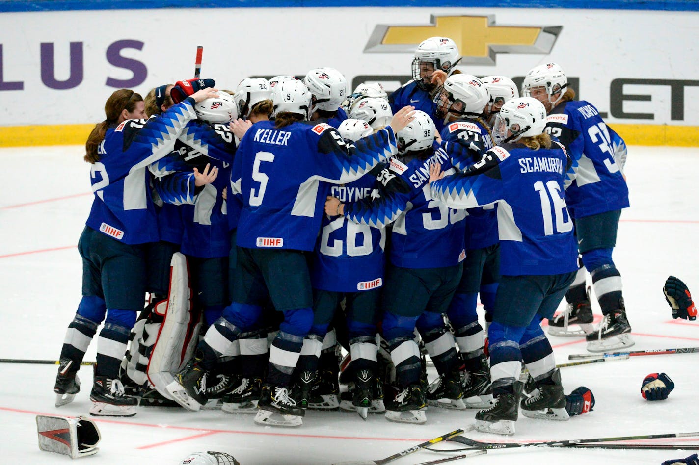 US players celebrate their 2-1 shootout victory after the IIHF Women's Ice Hockey World Championships final match between the United States and Finland in Espoo, Finland, on Sunday, April 14, 2019. (Mikko Stig/Lehtikuva via AP)