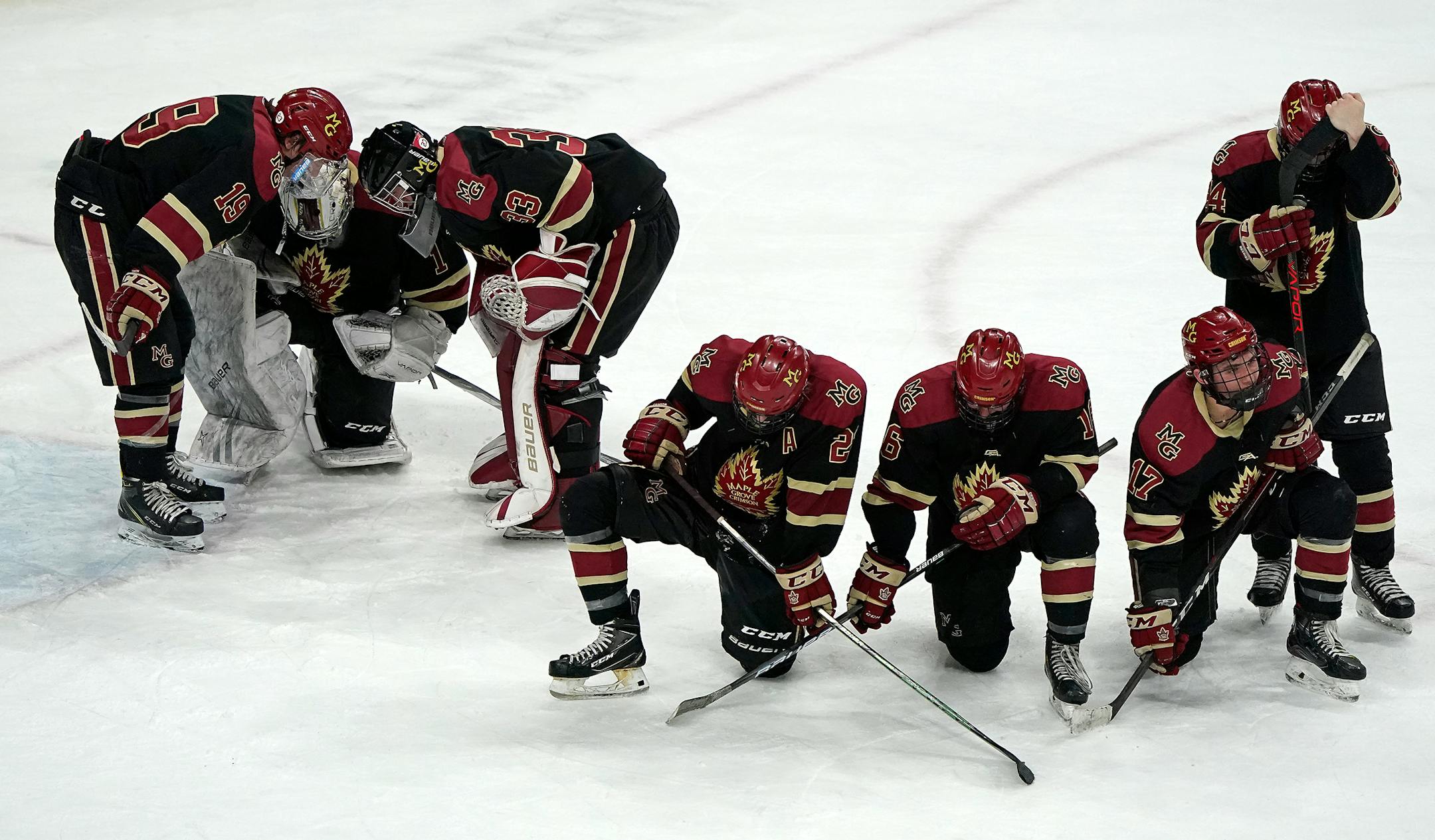 Maple Grove players were dejected after losing during overtime to Eden Prairie