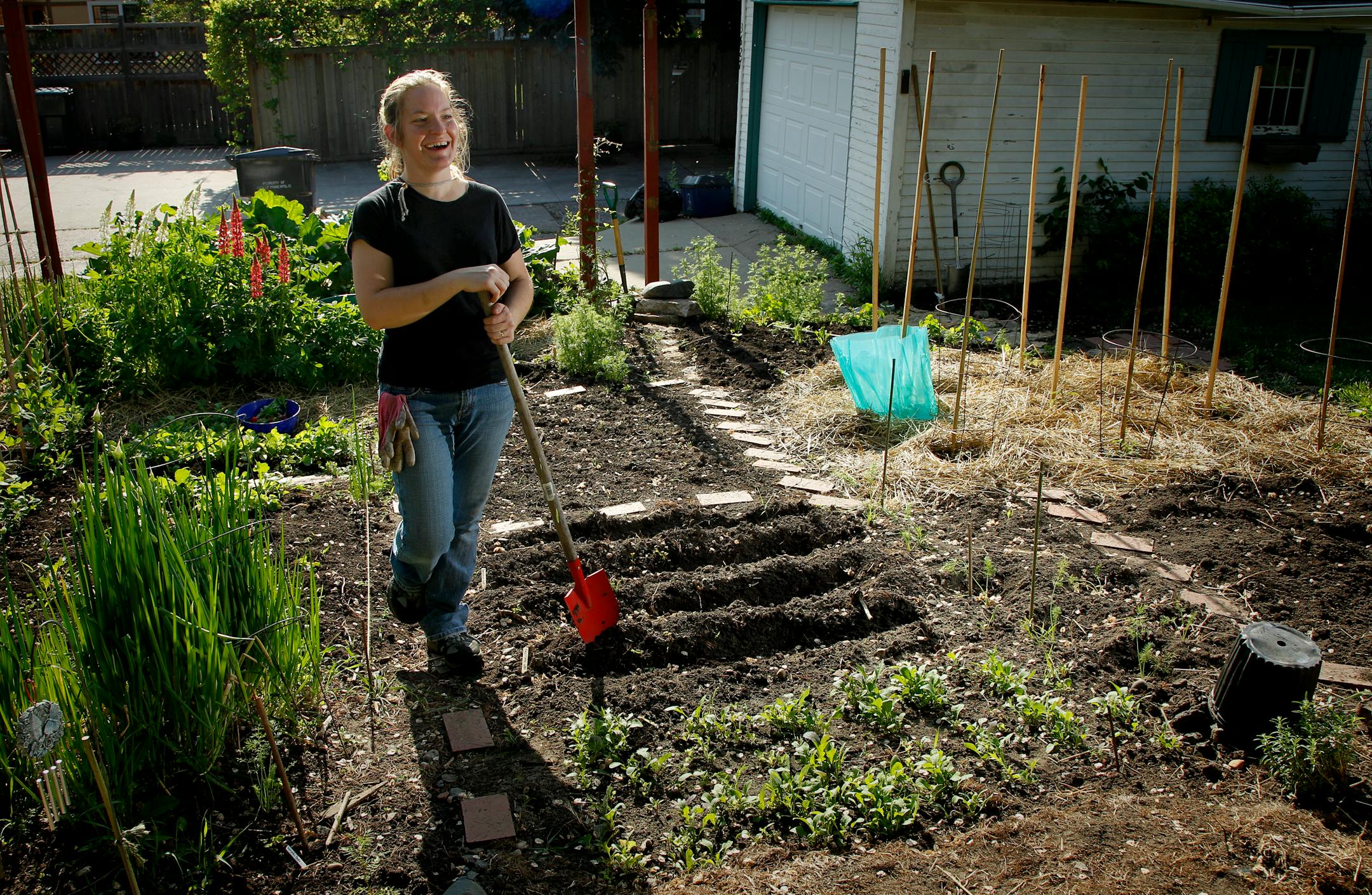 Gardener Catrina Mujwid-Cole grew up on a farm and tends gardens for a living. On her small city lot, she grows more than a dozen different veggies.