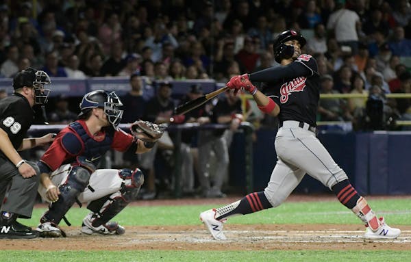 Cleveland's Francisco Lindor hits a home run against the Minnesota Twins during the fifth inning at Hiram Bithorn Stadium in San Juan