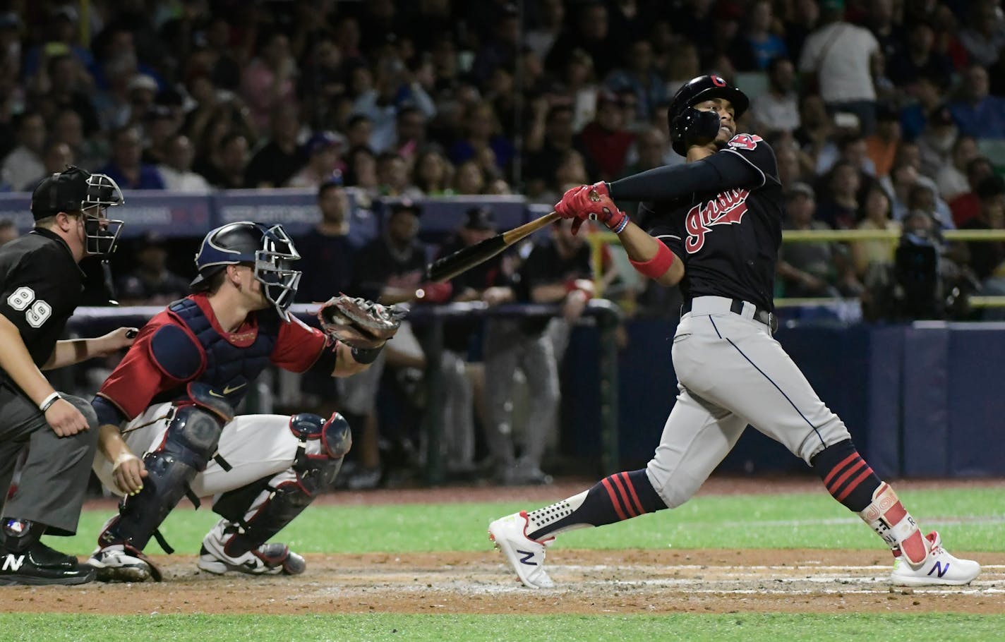 Cleveland's Francisco Lindor hits a home run against the Minnesota Twins during the fifth inning at Hiram Bithorn Stadium in San Juan