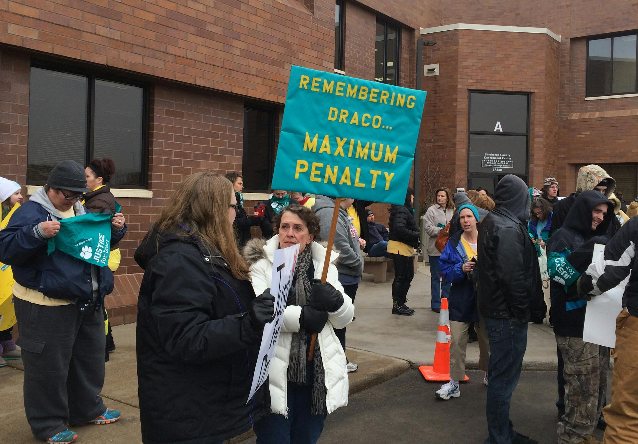 Dozens protest at the Sherburne County Courthouse.