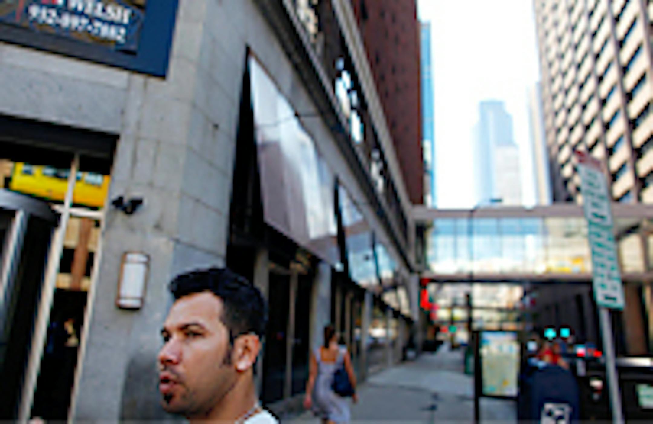 Thom Pham in front of the new location of Azia