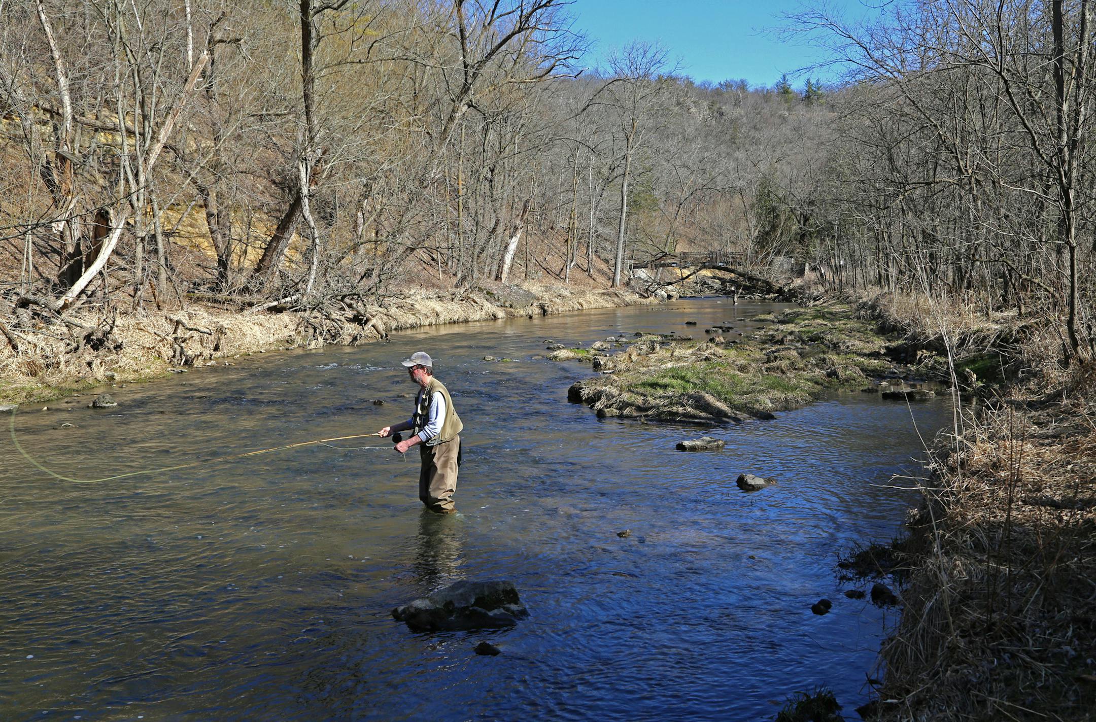 Billl Grehl of Lake Shore, Minn., north of Nisswa, cast a fly while fishing for trout in Whitewater State Park on Thursday. Grehl makes an annual camping and fishing trip to the park.