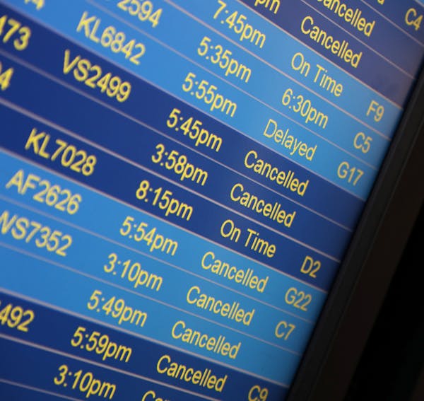 Video boards showed cancelled and delayed flights after MSP grounded all flights due to the snow. ] ANTHONY SOUFFLE &#x2022; anthony.souffle@startribu