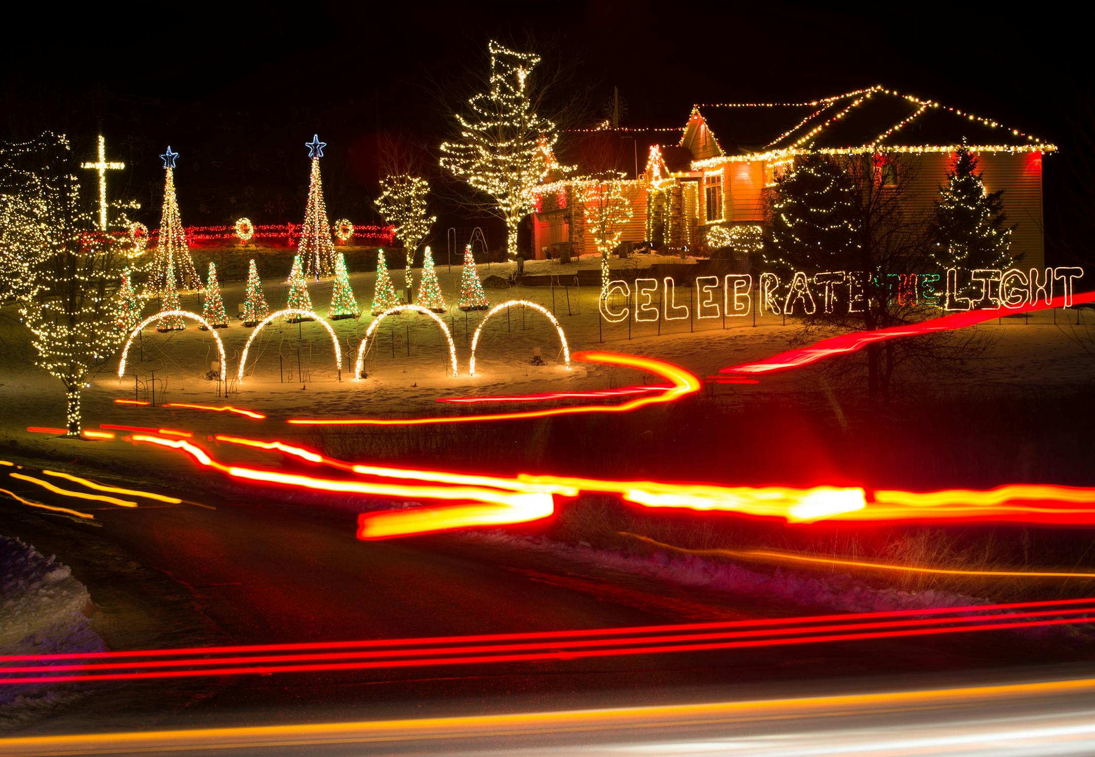 The head and tail lights from visiting cars leave light trails as they drive through the Koosman family's property to see their elaborate Christmas light decorations. ] AARON LAVINSKY &#x2022; aaron.lavinsky@startribune.com Chad Koosman began ringing for the Salvation Army six years ago and quickly got competitive with the top donation-getter in town. But when Koosman put the red kettle among the growing light show in his front yard, there was no contest. In the past four years, the massive disp