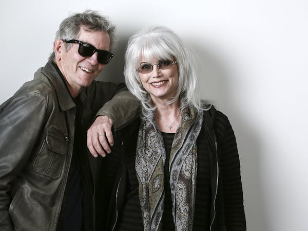 In this April 30, 2015 photo, musicians Rodney Crowell, left, and Emmylou Harris pose for a portrait to promote their album "The Traveling Kind" in Ne
