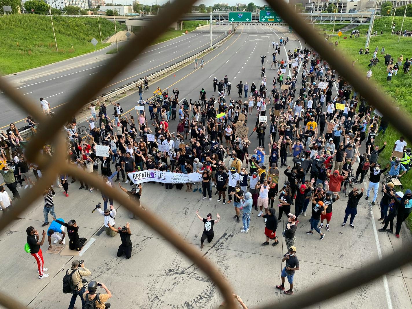 Protesters marched toward law enforcement after curfew Sunday night on a closed Interstate 35W in Minneapolis.