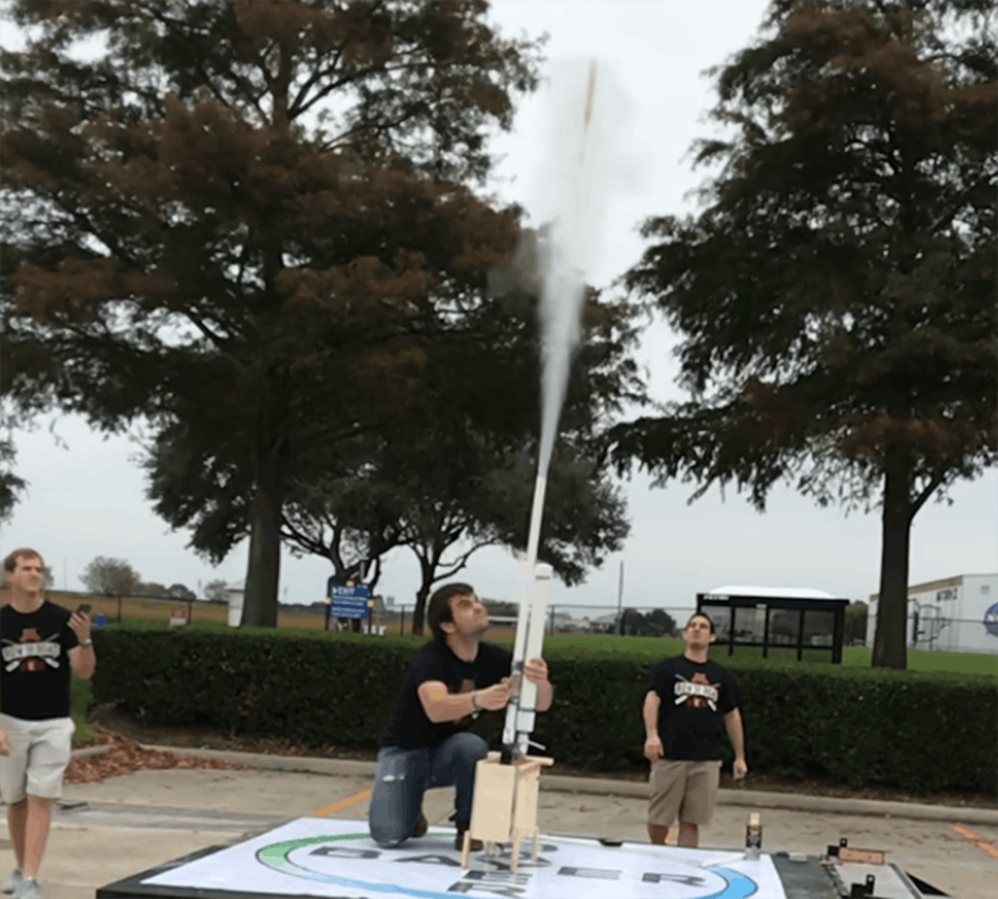 Kevin Schrader launched the U team's rocket, with Machlen Polfliet at left and Jeffrey Guevara.