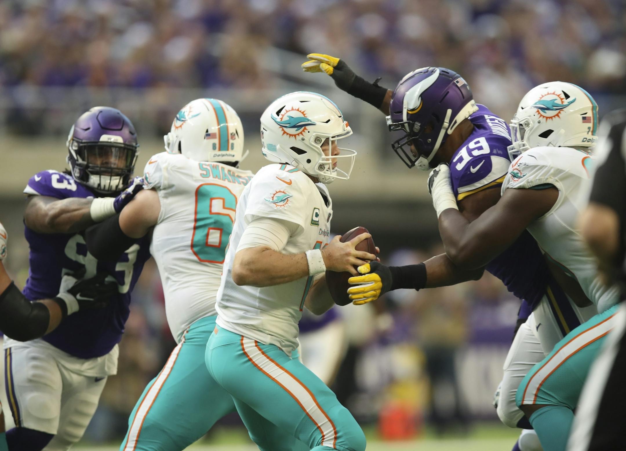 Miami Dolphins quarterback Ryan Tannehill (17) was sacked for a nine yard loss by Minnesota Vikings defensive end Danielle Hunter (99) in the third quarter.