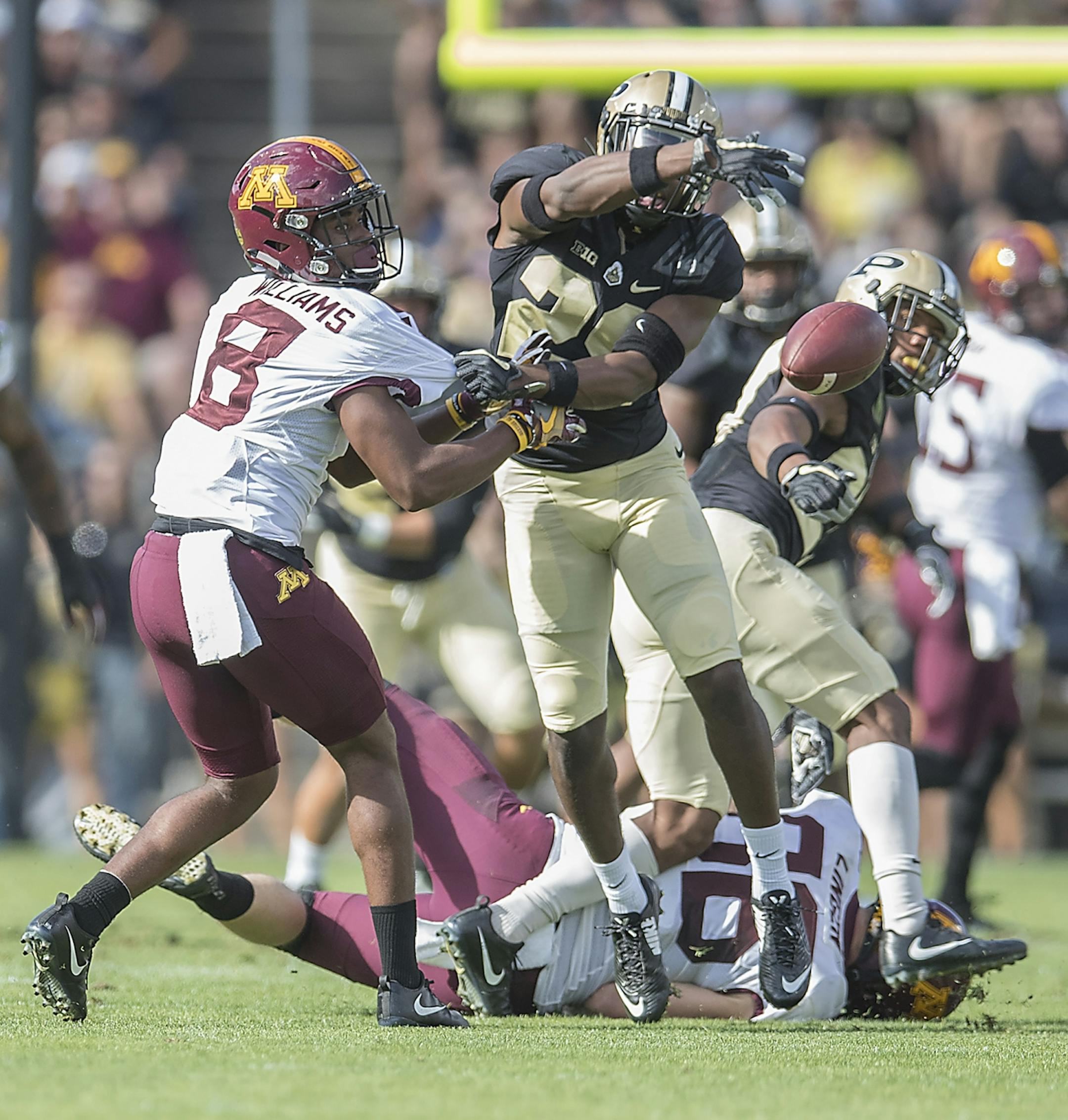 Purdue's cornerback Simeon Smiley and Minnesota's wide receiver Mark Williams battled for a loose ball during the first quarter the Gophers took on Purdue at Ross-Ade Stadium, Saturday, October 7, 2017 in West Lafayette, IN.