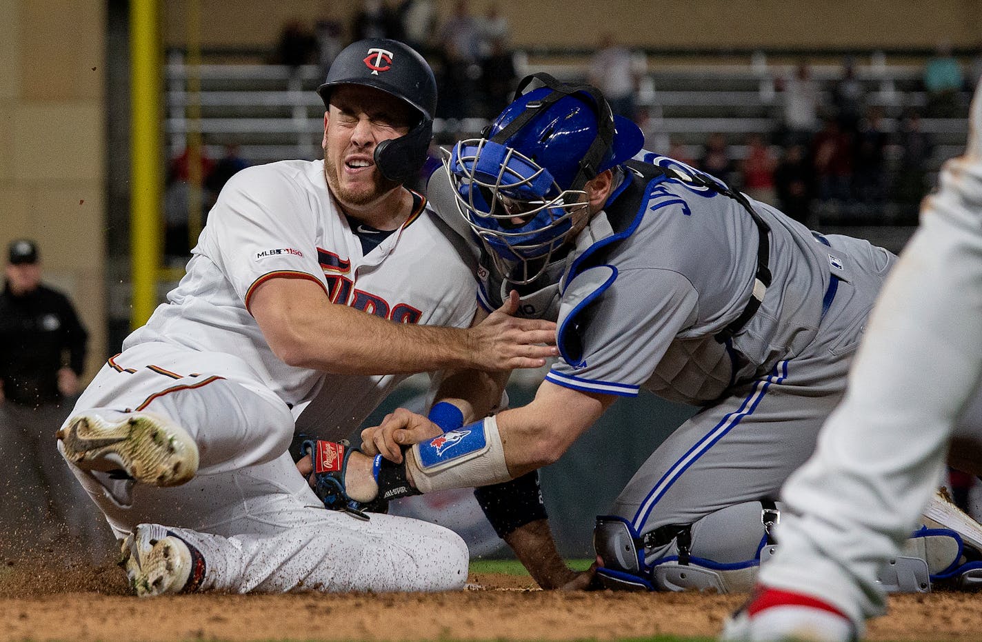 C.J. Cron rumbled for home on Byron Buxton's ninth-inning double, only to be tagged out by Toronto catcher Danny Jansen.