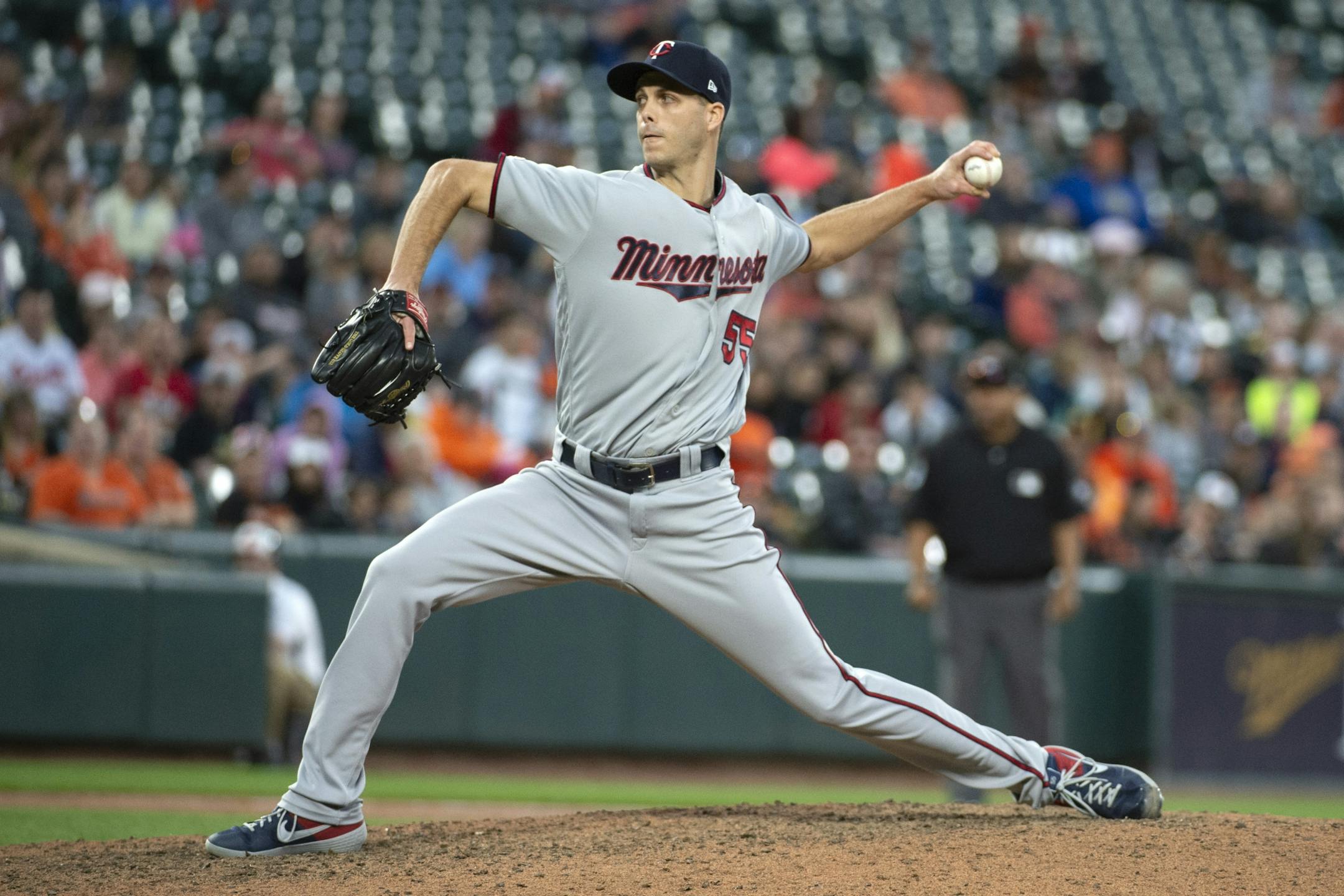 Minnesota Twins relief pitcher Taylor Rogers delivers in the ninth inning of a baseball game against the Baltimore Orioles, Saturday, April 20, 2019, in Baltimore.