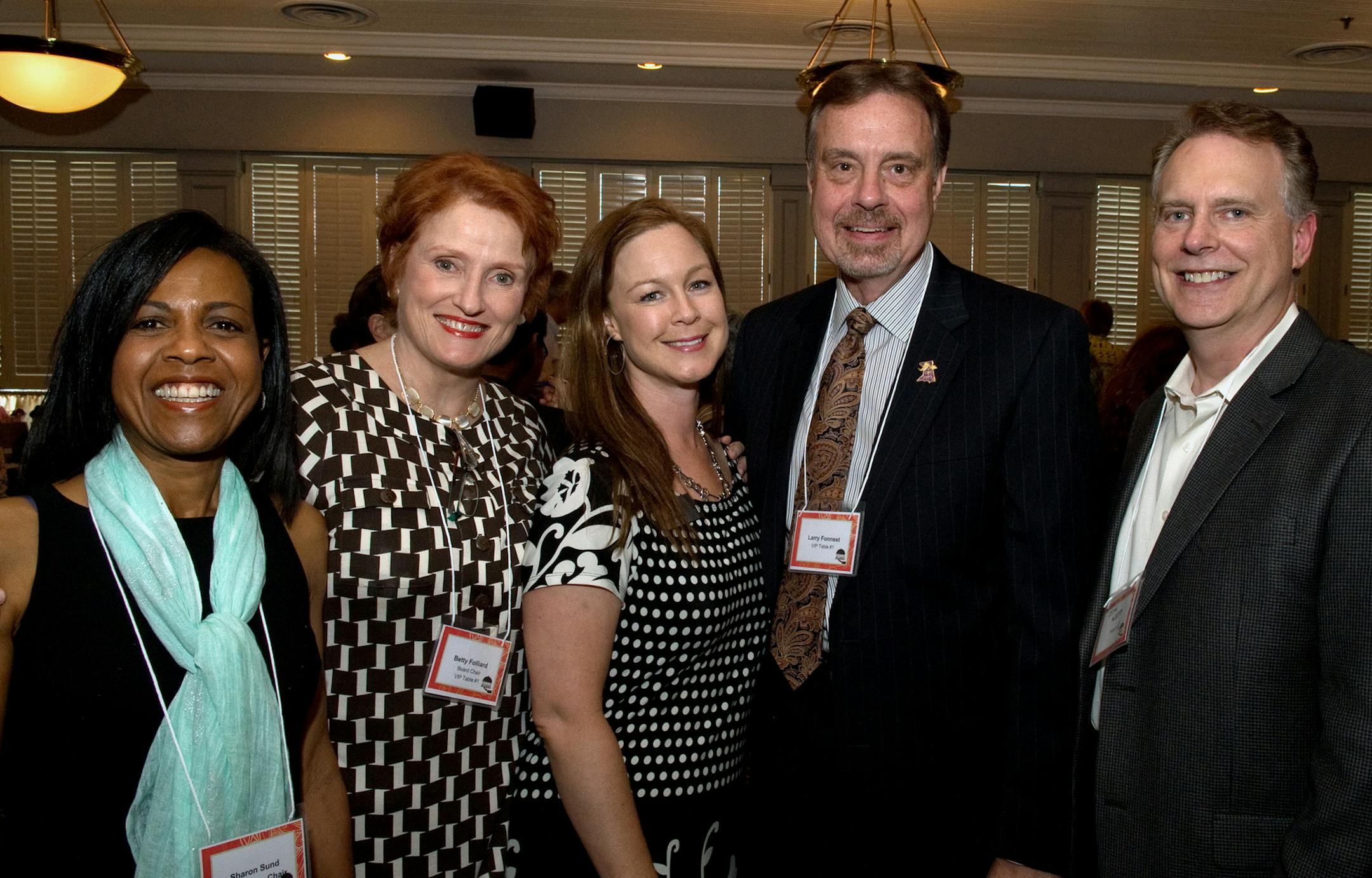 From left to right, PRISM board vice chair, Sharon Sund, PRISM board chair, Betty Folliard, PRISM executive director, Michelle. Ness, Golden Valley City Council member, Larry Fonnest and his partner, Jim Nepp. ] (SPECIAL TO THE STAR TRIBUNE/BRE McGEE) **Sharon Sound (left, PRISM board vice chair), Betty Folliard (second from left, PRISM board chair), Michelle Ness (center, PRISM executive director), Larry Fonnest (second from right, Golden Valley City Council member), Jim Nepp (right, Larry Fonn