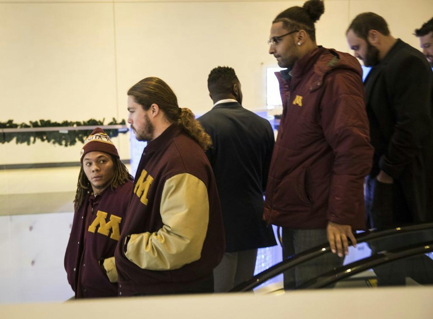 Gophers football players, none who were suspended from the team, left a lawyer's office in downtown Minneapolis on Friday. Later, some of the players met with university President Eric Kaler.