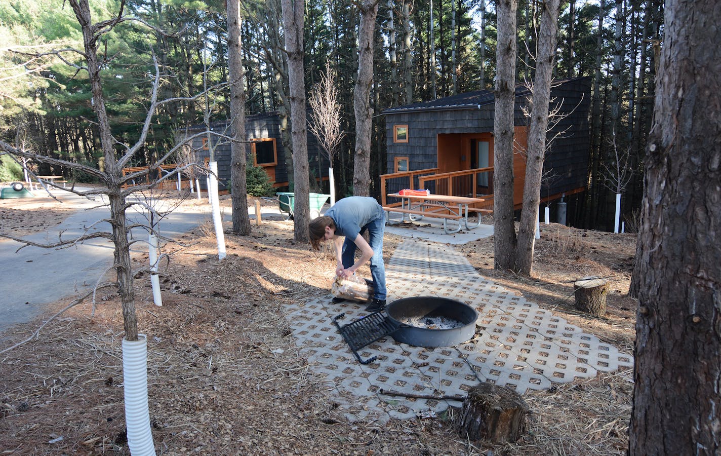 Whitetail Woods: Tom Lemmer, of Minneapolis, made a campfire. The park&#x2019;s new camper cabins are open year-round.