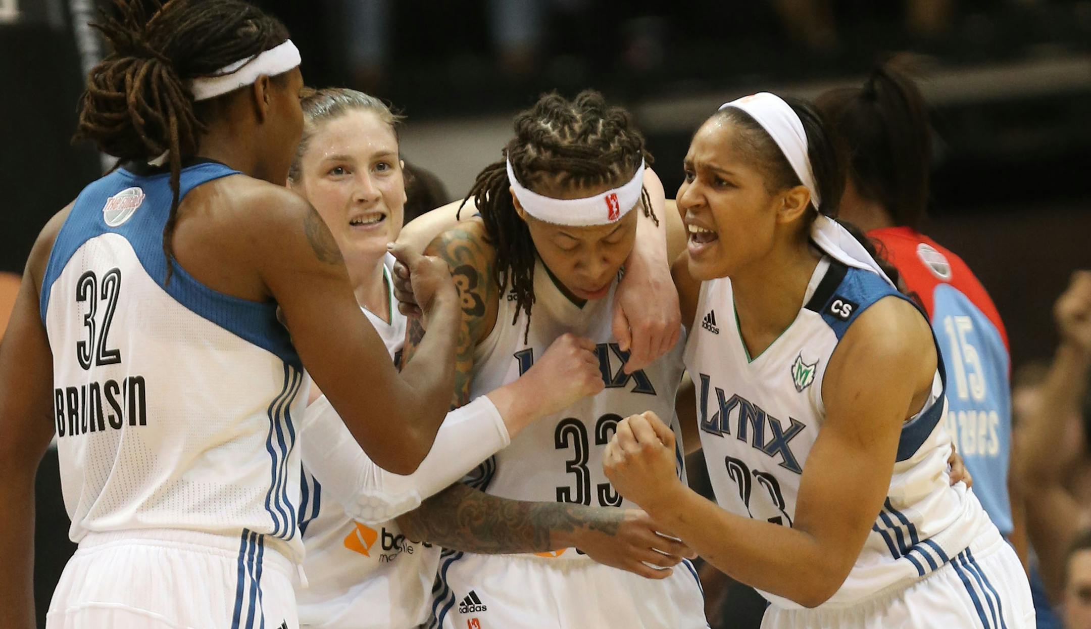 Seimone Augustus #33 of the Minnesota Lynx got surrounded by her teammates Rebekkah Brunson, Lindsay Whalen #13 and Maya Moore #23 of the Minnesota Lynx after Augustus gott the basket and the foul oduring the fourth third quarter of Game 2 of the WNBA Finals at Target Center in Minneapolis, Min., Tuesday, October 8, 2013 Lynx won 88-63. ] (KYNDELL HARKNESS/STAR TRIBUNE) kyndell.harkness@startribune.com